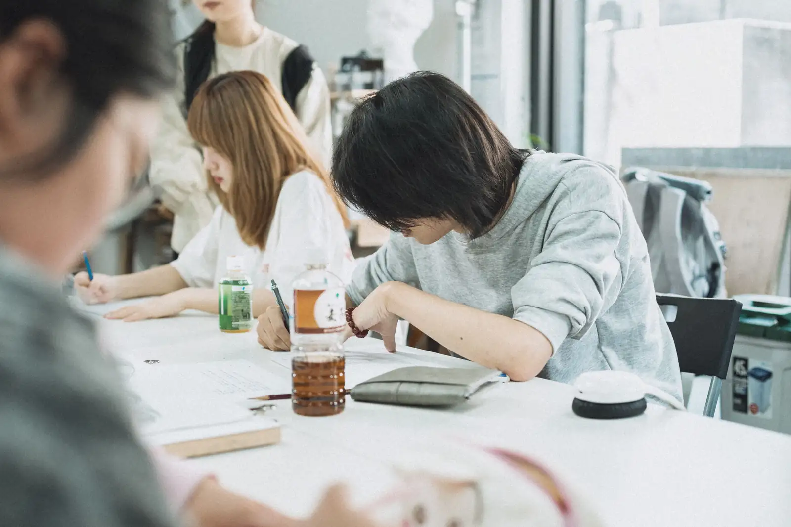 Japan: Cabinet Approves Nationwide LGBTQ+ Education and Training Plan Students studying together around a table